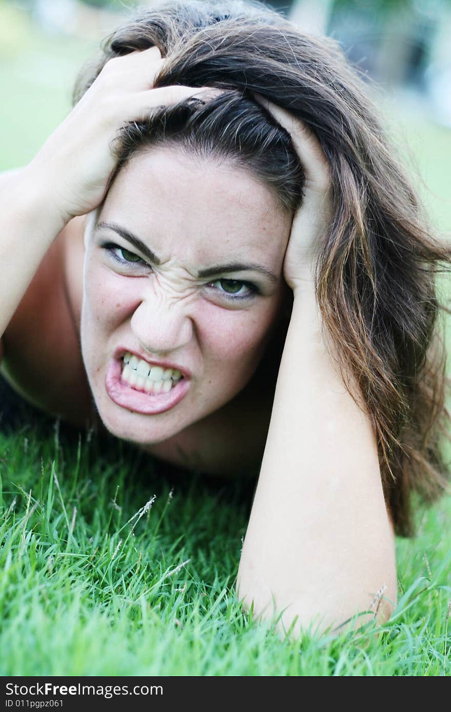 Portrait of a woman with an angry expression.