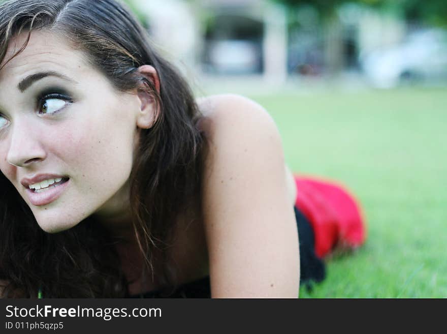 Portrait of a beautiful young woman at the park. Portrait of a beautiful young woman at the park.