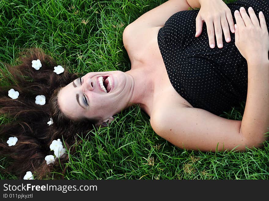 Portrait of a beautiful young woman with flowers in her hair.