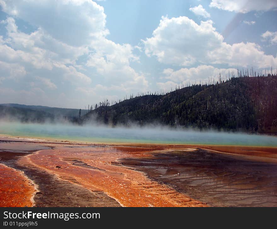 Steam rising over grand prismatic spring in yellowtone national park. Steam rising over grand prismatic spring in yellowtone national park