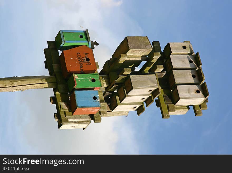 Nestling boxes against blue sky