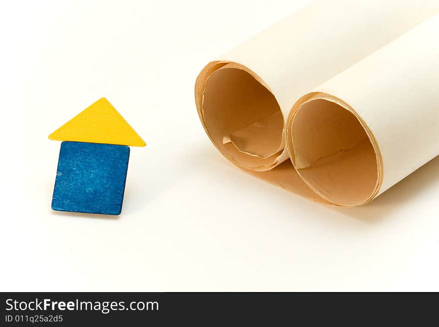 House and paper roll isolated over white background. House and paper roll isolated over white background