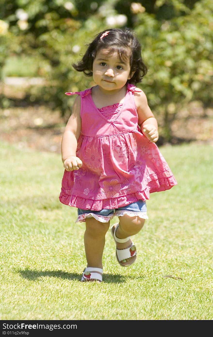 Girl running around in the playground.