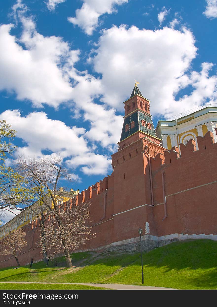 White clouds over red brick wall of Moscow Kremlin. White clouds over red brick wall of Moscow Kremlin