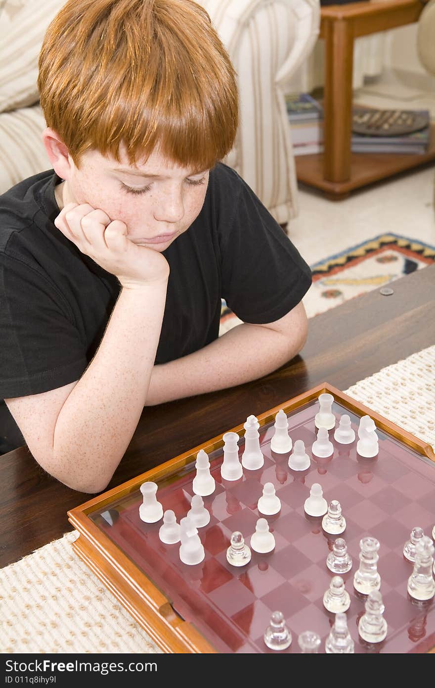 Red Head Boy Playing Chess