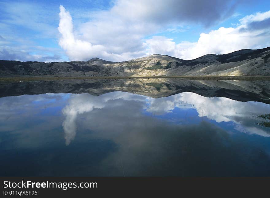 At the end of winter the thaw make a little lake where the hills see they self in the mirror. At the end of winter the thaw make a little lake where the hills see they self in the mirror.