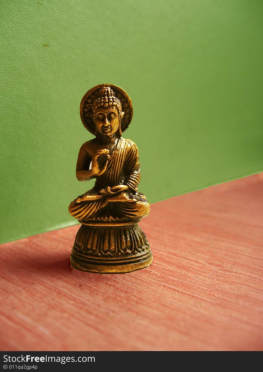 A small idol of Lord Buddha made of bronze metal