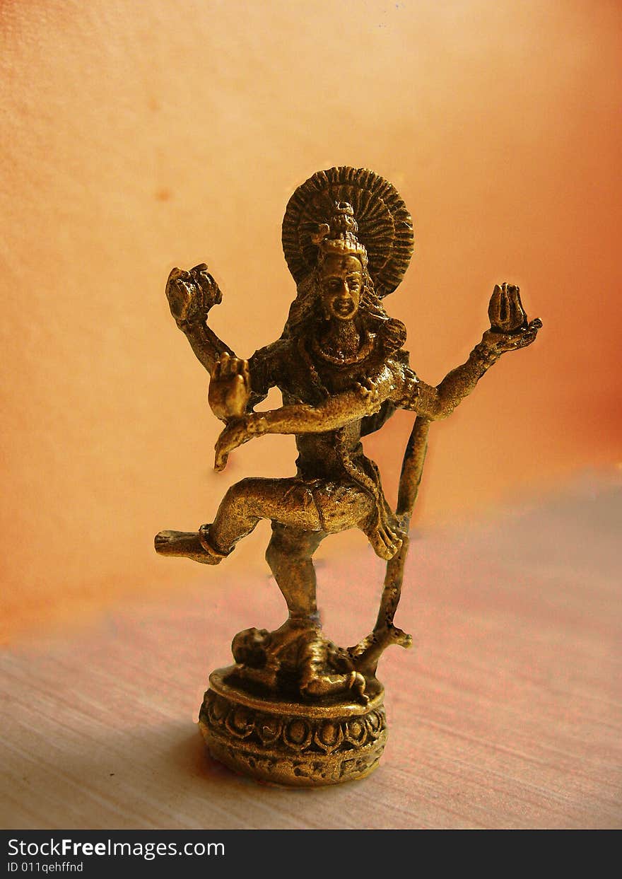 A small idol of the powerful Lord Shiva in his dance pose made of bronze metal, of hindu religion