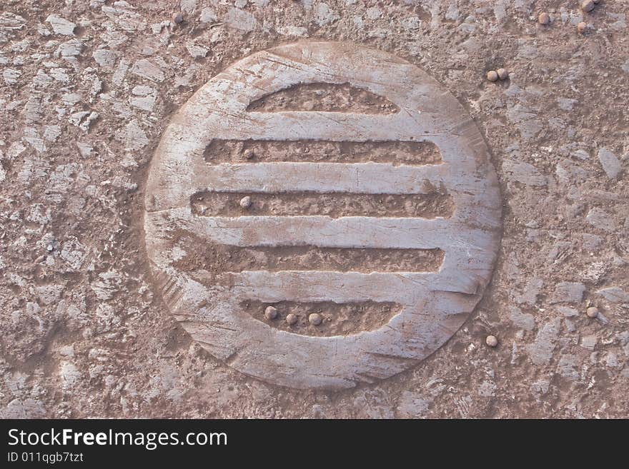 On pavement circular ferroguinous sewer fence. On pavement circular ferroguinous sewer fence