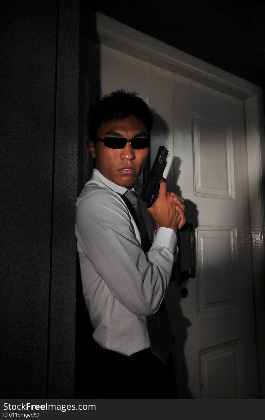 Picture of Agent or Killer. Low key photography suitable for themes of modern security, terrorism and police counter terrorist acts. Picture of Agent or Killer. Low key photography suitable for themes of modern security, terrorism and police counter terrorist acts.