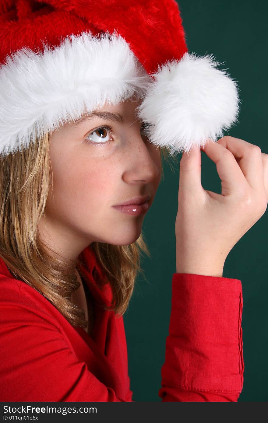 Teenager wearing a red shirt and a christmas hat