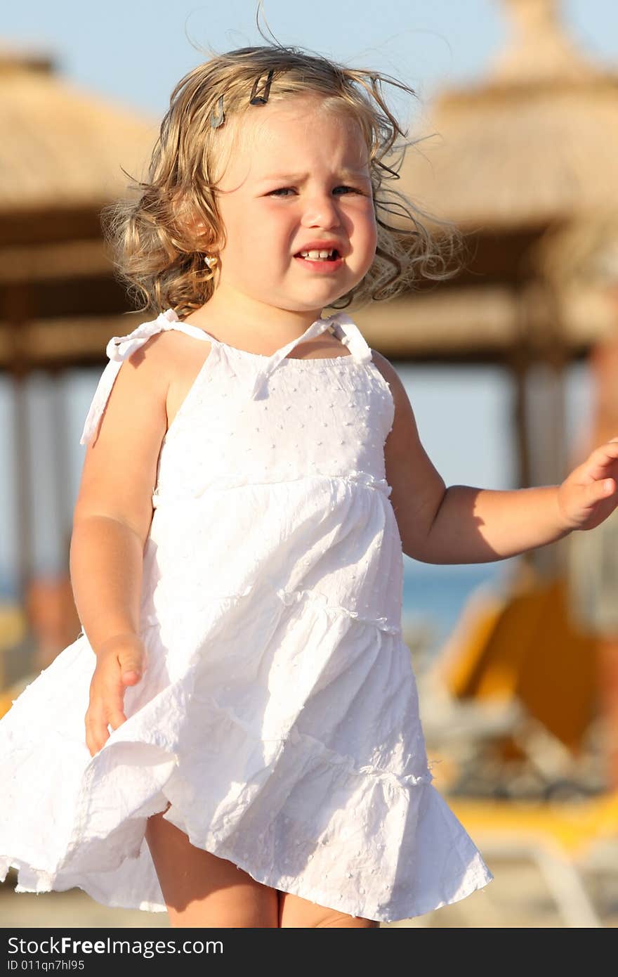 Beauty a little girl at beach in the sea