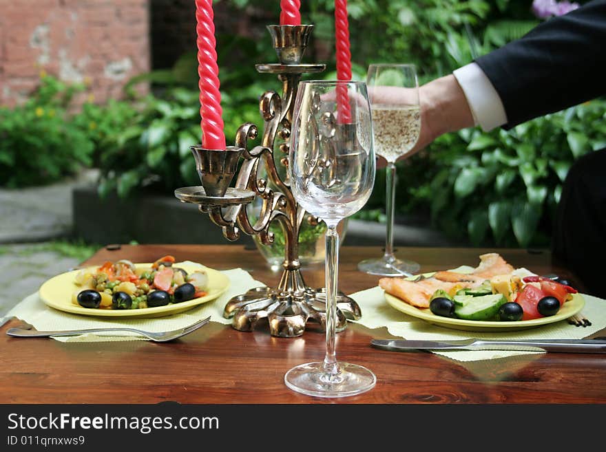 Crystal glass on the table. Outdoor.