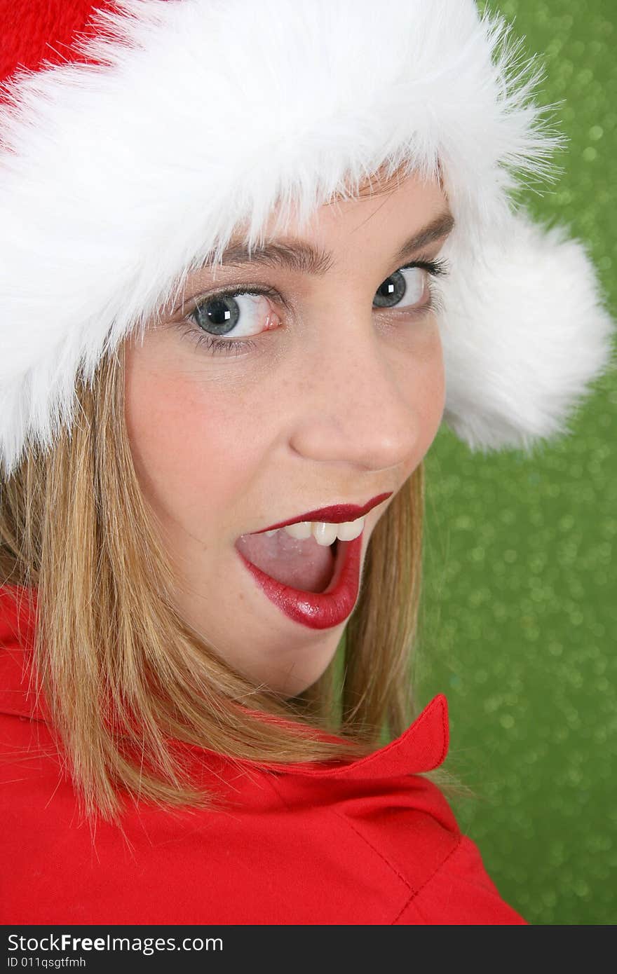 Teenager with red lips wearing a christmas hat. Teenager with red lips wearing a christmas hat