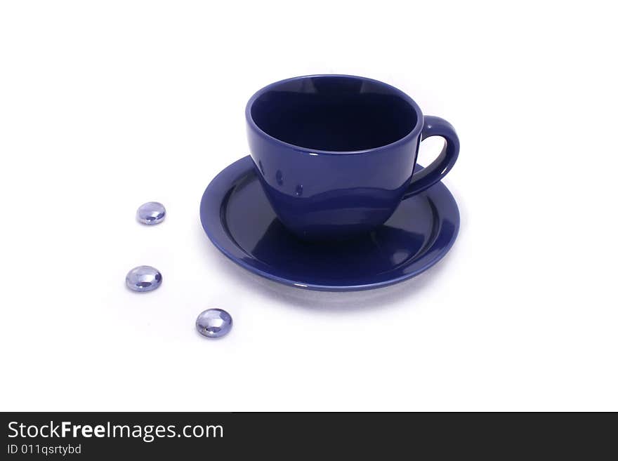 Cup And Saucer On White Background With Stones