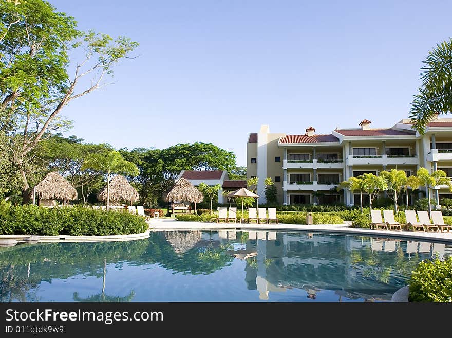 A tropical resort with a blue lagoon pool. A tropical resort with a blue lagoon pool