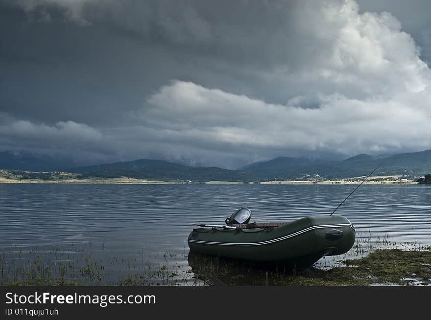 Landscape with lake and boat