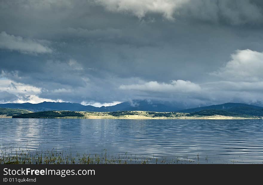 Landscape with lake and clouds