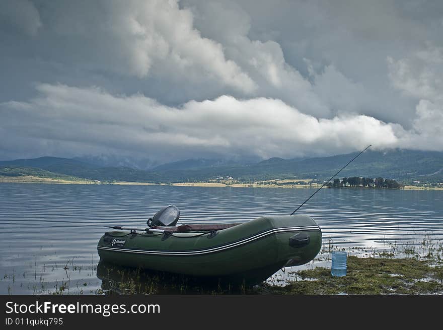 Landscape with lake and boat