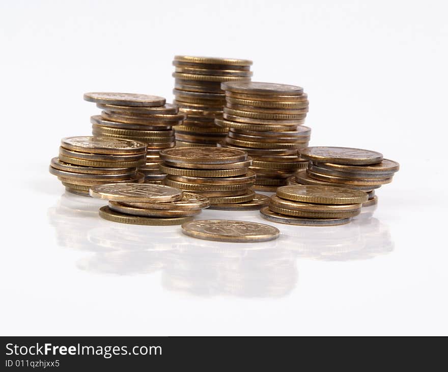 Stacks of coins isolated on white. Stacks of coins isolated on white