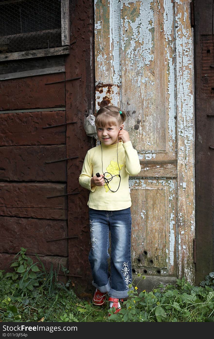 An image of little girl walking with MP3. An image of little girl walking with MP3