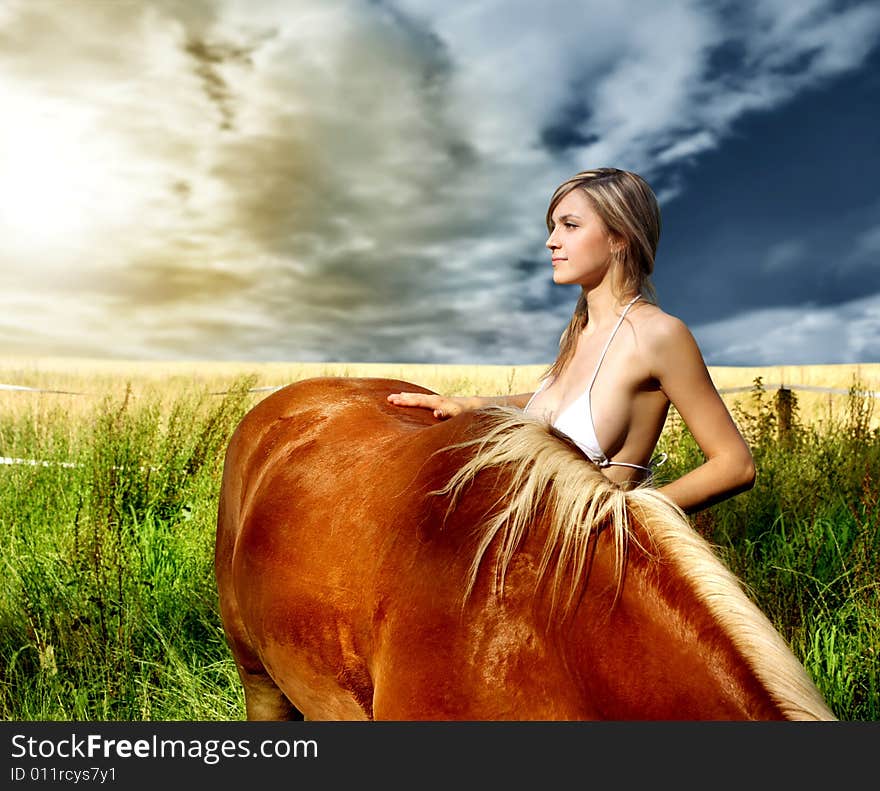 A beautiful woman with a horse. A beautiful woman with a horse