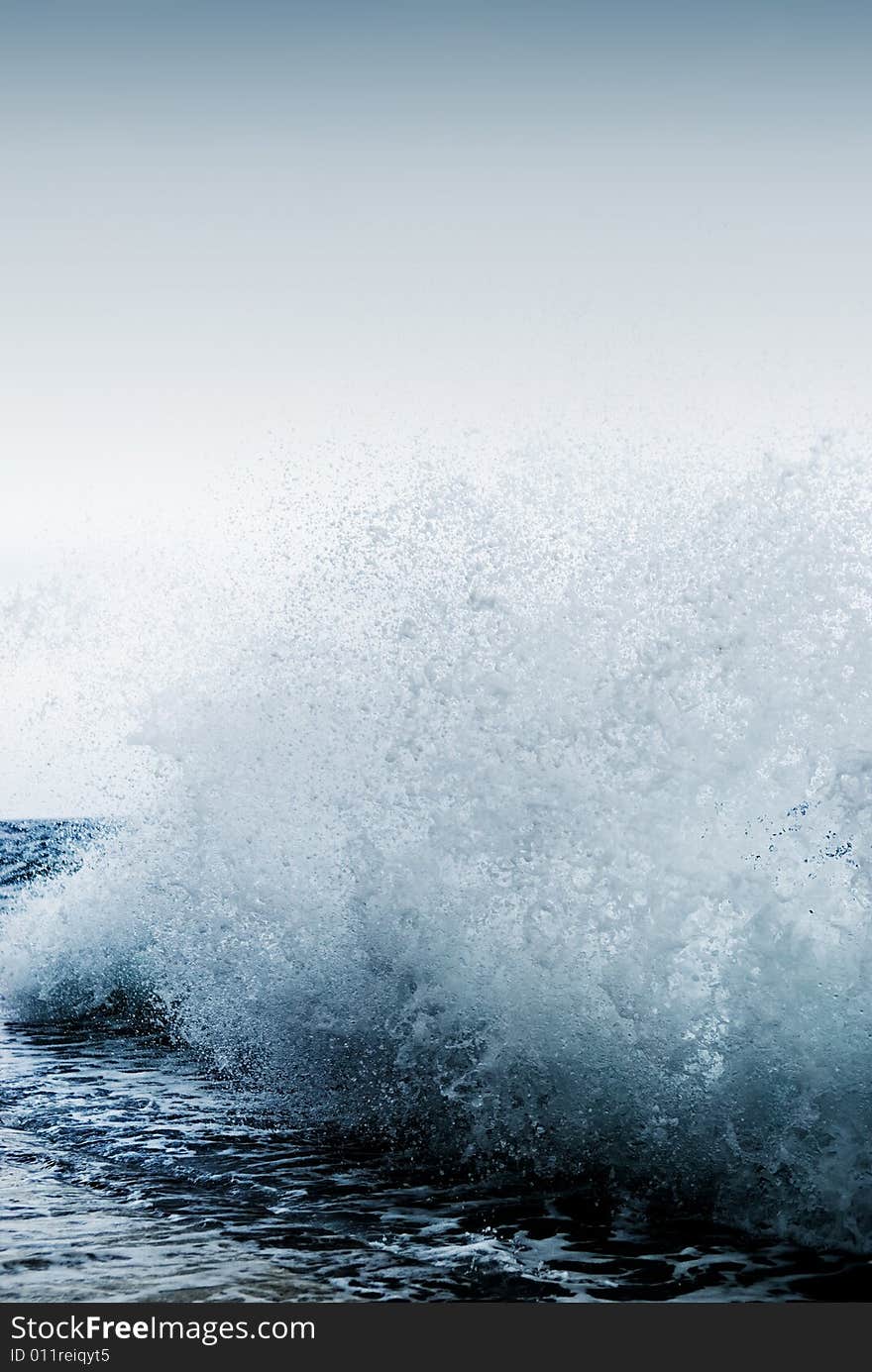 Big ocean wave breaking the shore