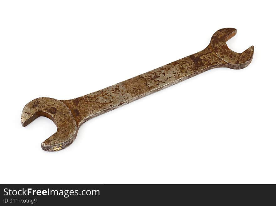 Old rusty spanner isolated on white background