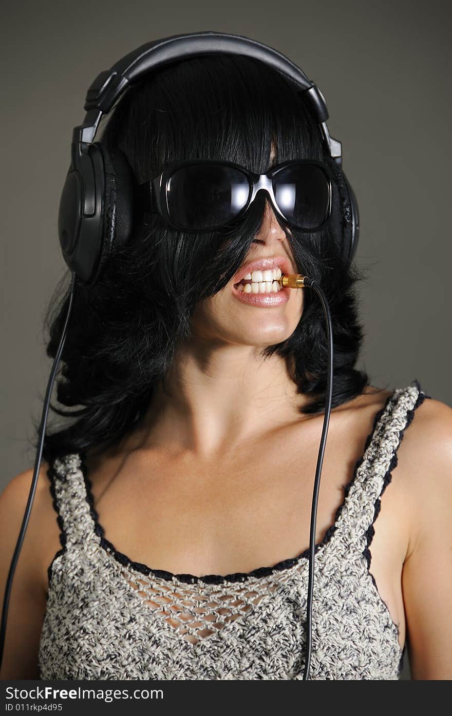 Portrait of young bizarre woman with headphones. Portrait of young bizarre woman with headphones