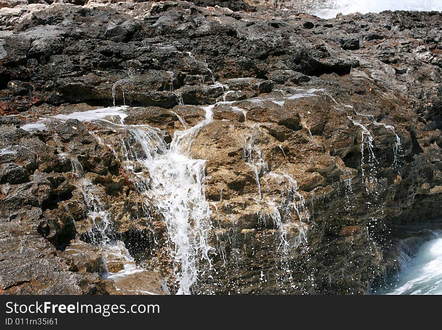 Splash of sea water on a rock