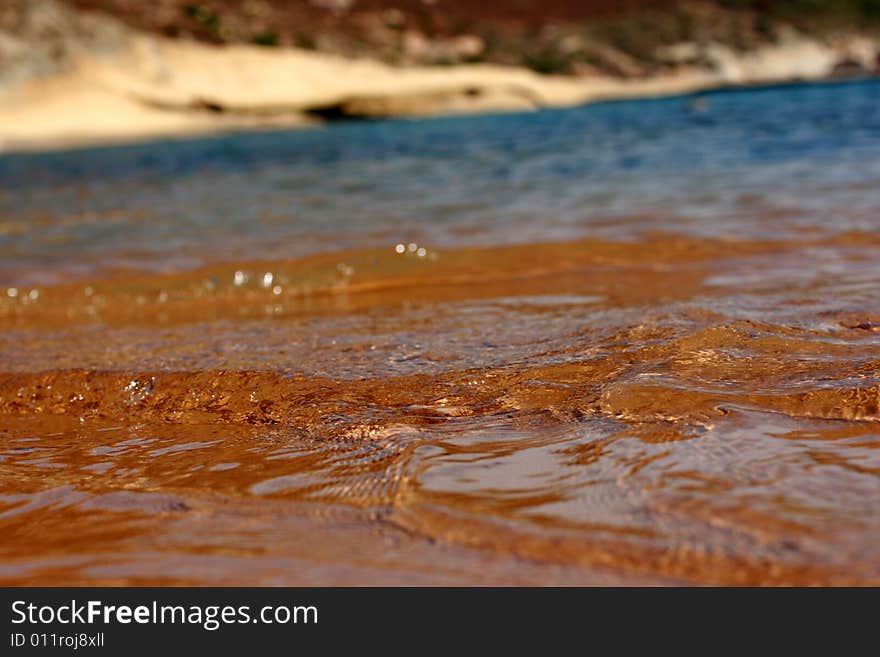 Transparent sea water on a sandy beach