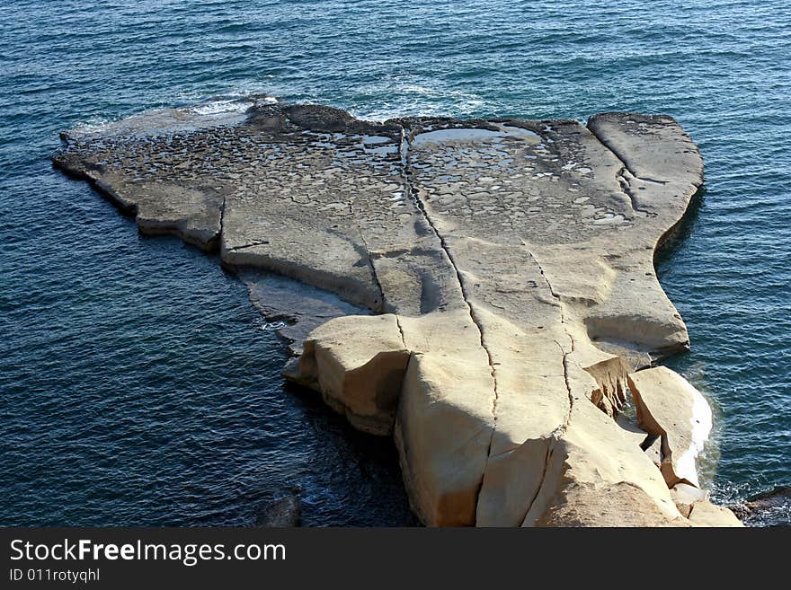 Whales tail - half-island in a sea