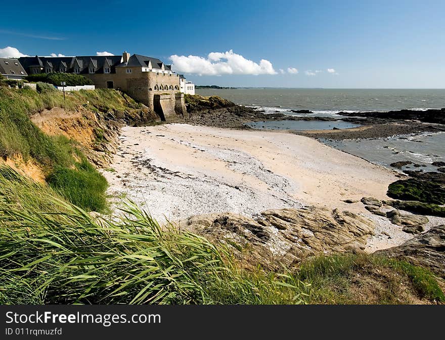 Landscape view of a castle overhanging the wild coast of Britain, France. Landscape view of a castle overhanging the wild coast of Britain, France