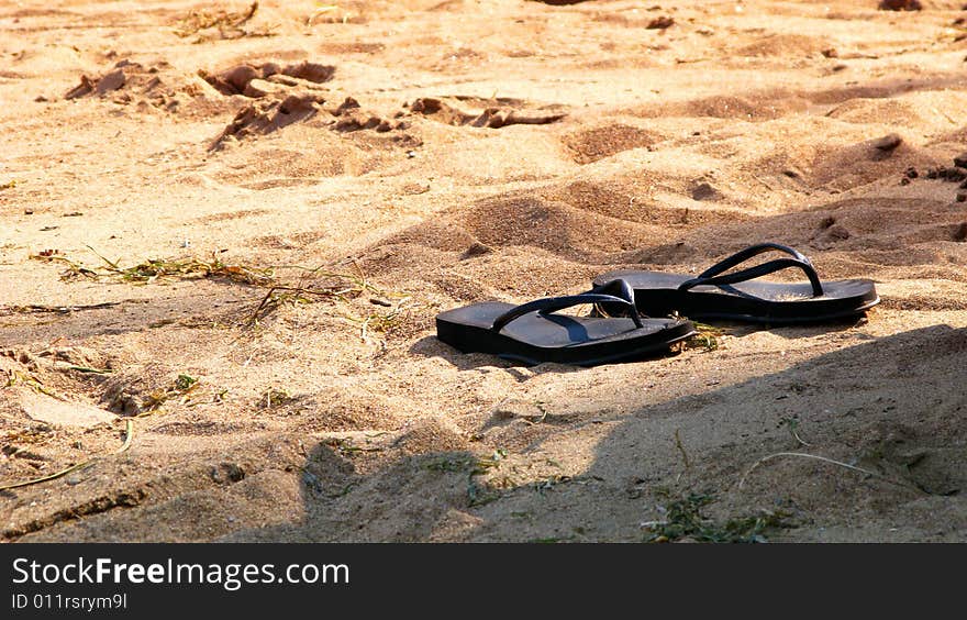 Slippers In Sand