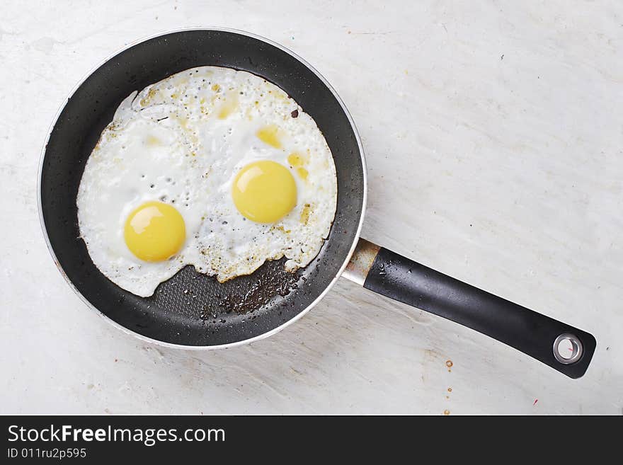 Hot fried eggs on the frying-pan. Hot fried eggs on the frying-pan.