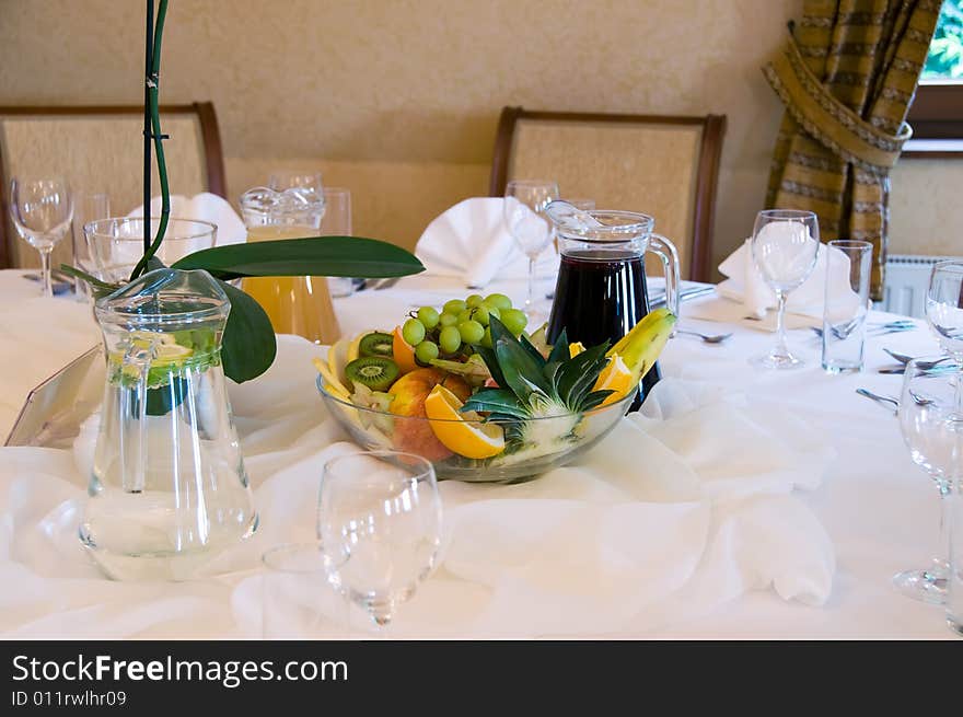 Fruits, juice and water on banquet table. Fruits, juice and water on banquet table