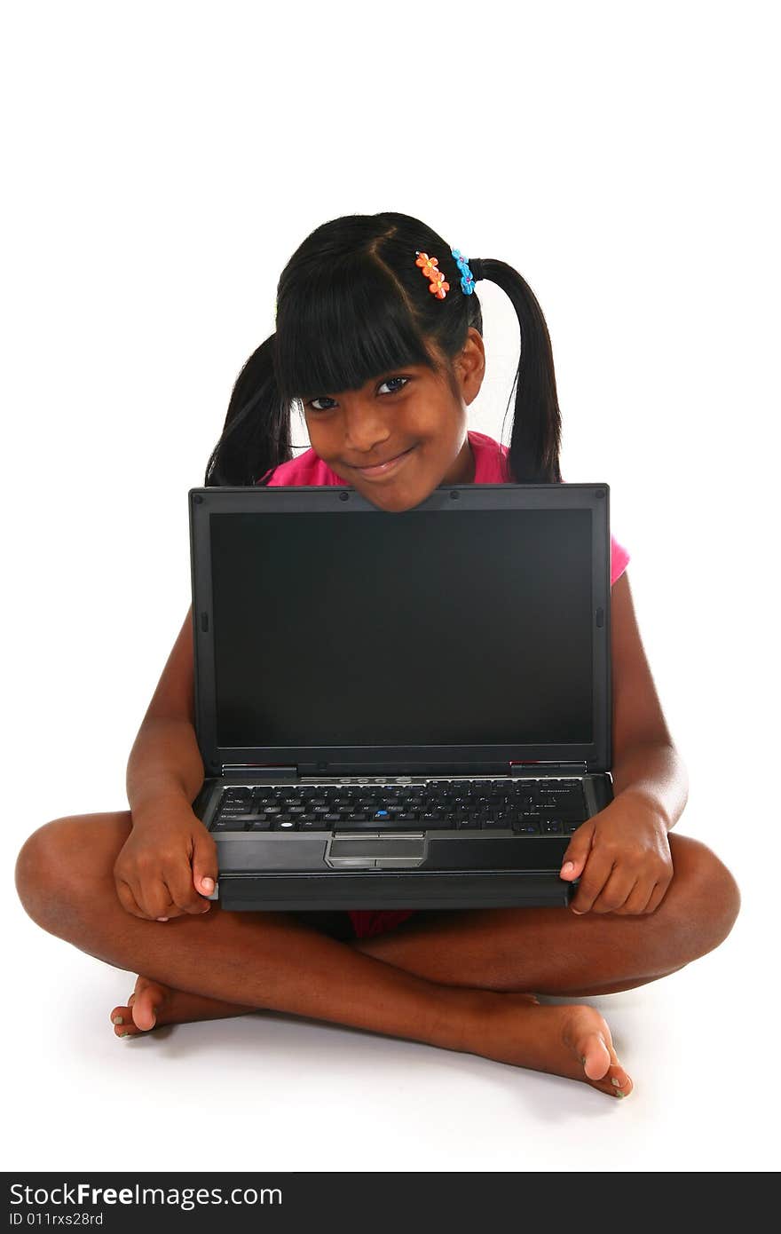 Beautiful 10 year old Indian child with laptop. Beautiful 10 year old Indian child with laptop.