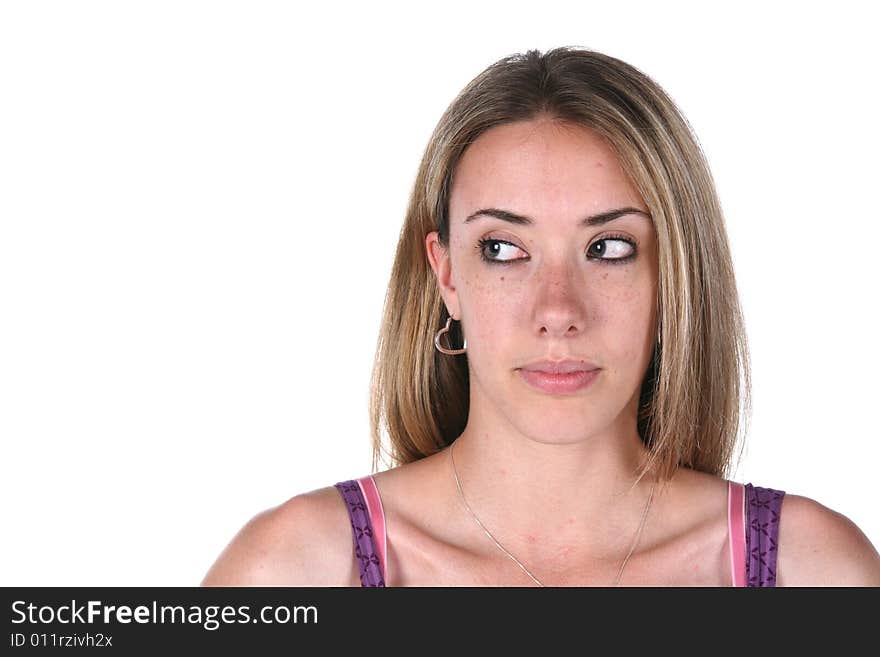 Teenage girl looking sideways at the blank copy space on the left. Teenage girl looking sideways at the blank copy space on the left