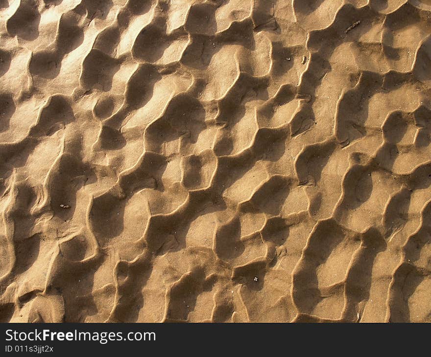 Pattern in sand created by outgoing tide. Pattern in sand created by outgoing tide