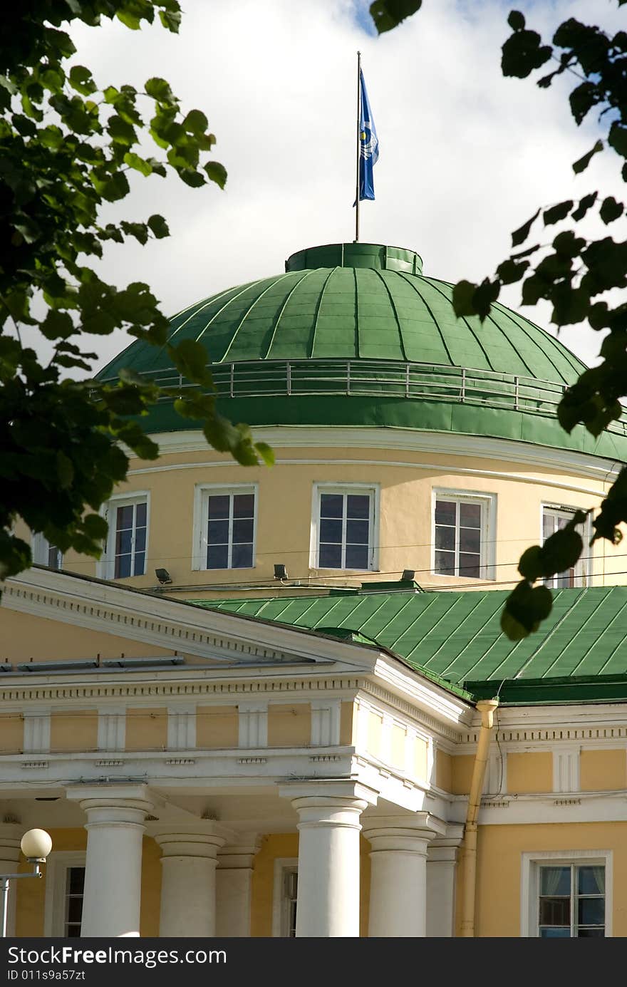 Building of establishment with a tower and a flag