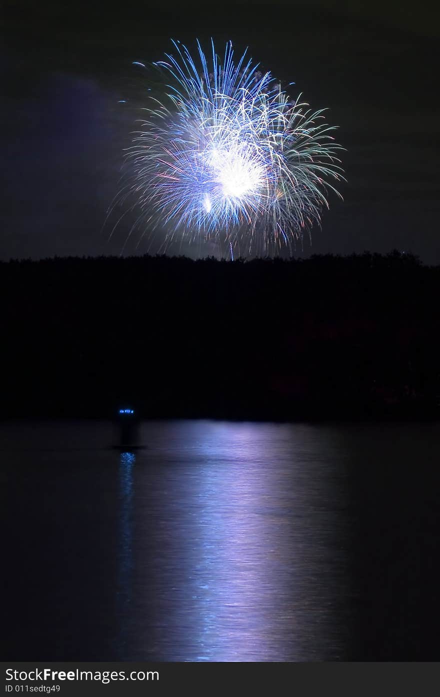 Firework and reflection on water