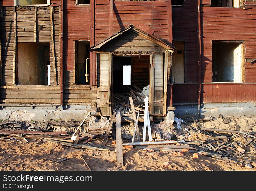 Facade of the old blasted wooden house. Facade of the old blasted wooden house