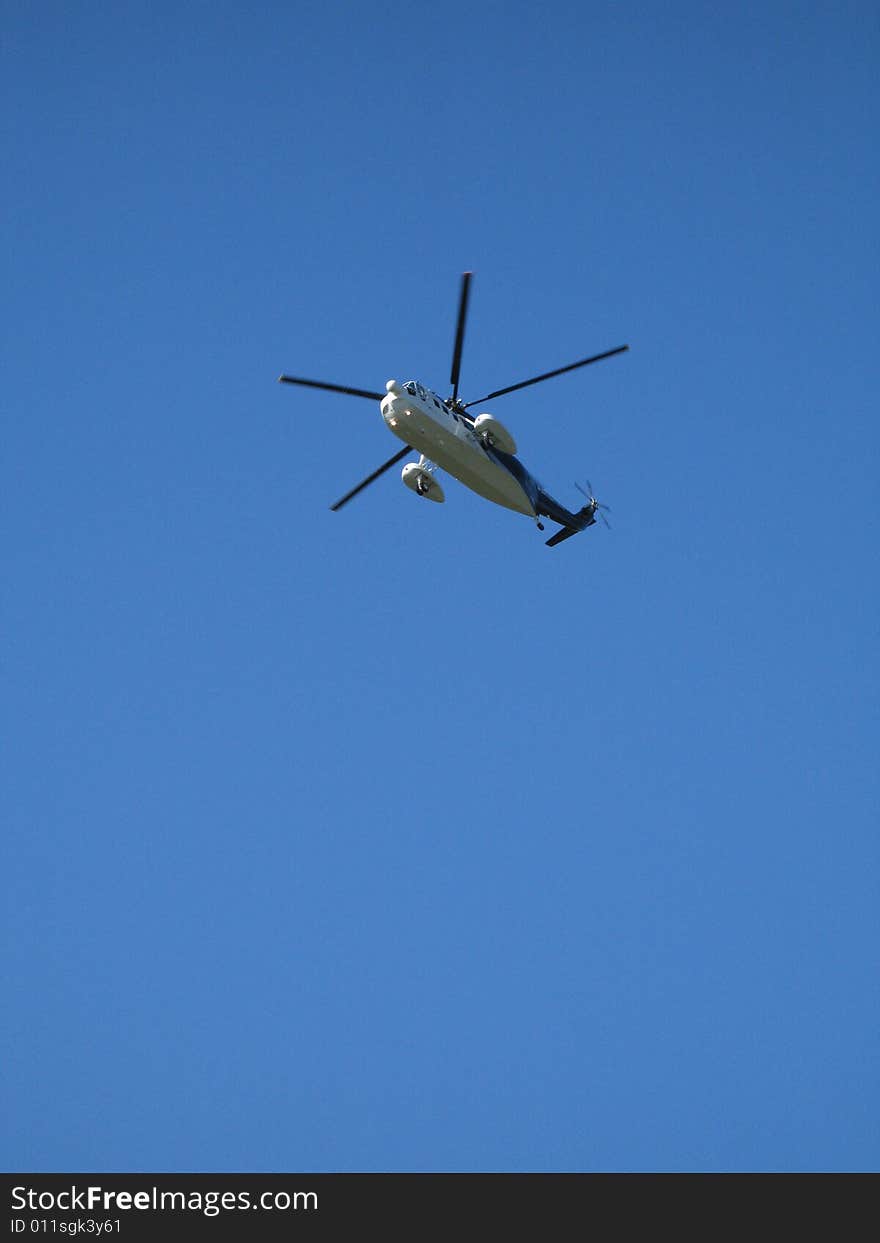 Helicopter flying in the blue sky