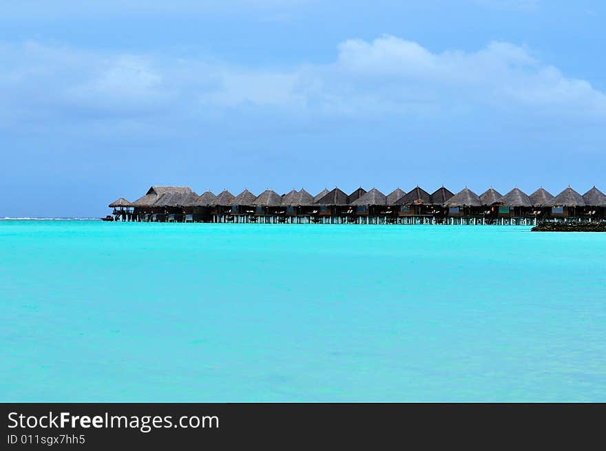 Island of Paradise. White sand beaches with coco-tree and crystal blue water. Maldives. Luxury holidays. Island of Paradise. White sand beaches with coco-tree and crystal blue water. Maldives. Luxury holidays.