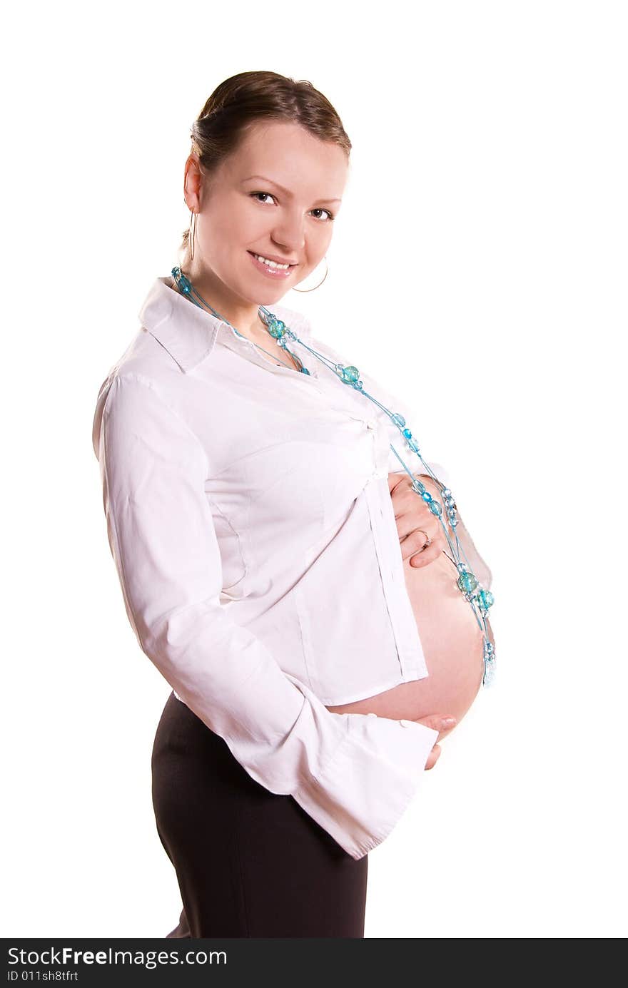 Beautiful pregnant woman against white background