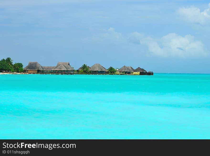 Island of Paradise. White sand beaches with coco-tree and crystal blue water. Maldives. Luxury holidays. Island of Paradise. White sand beaches with coco-tree and crystal blue water. Maldives. Luxury holidays.