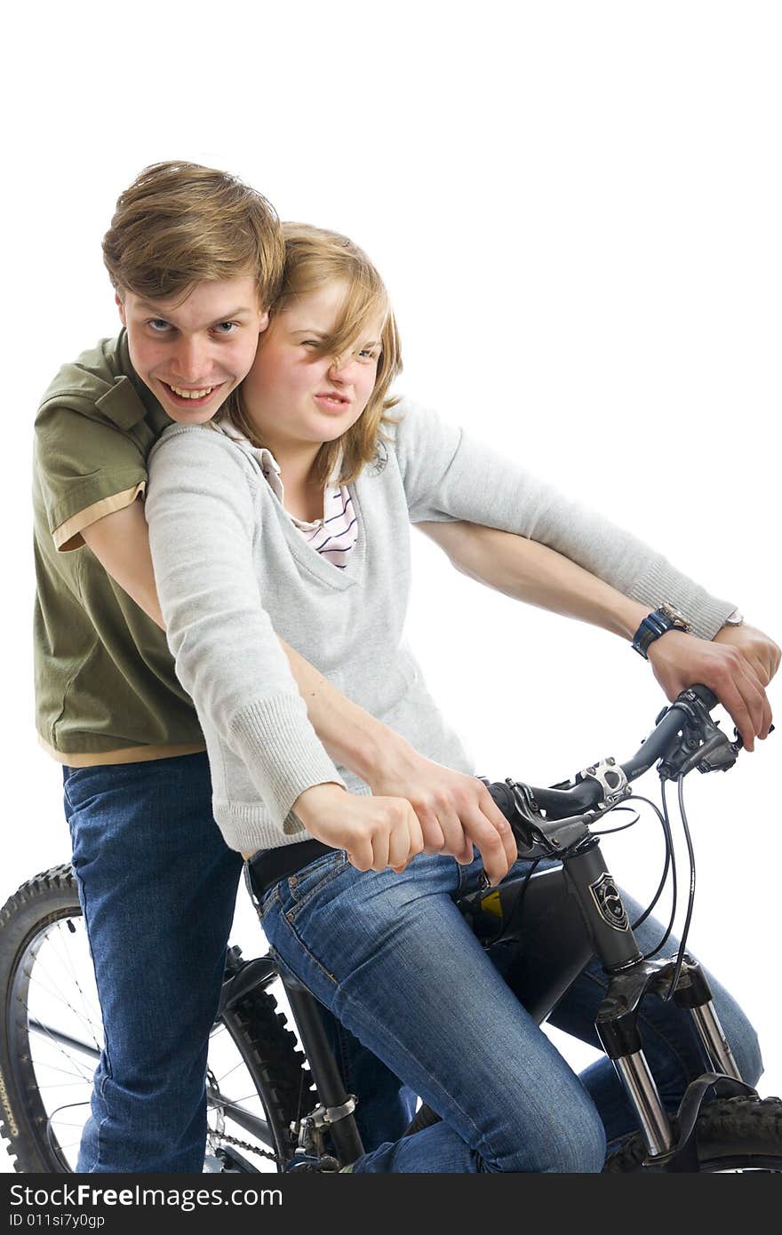 Young couple on a bicycle isolated on a white