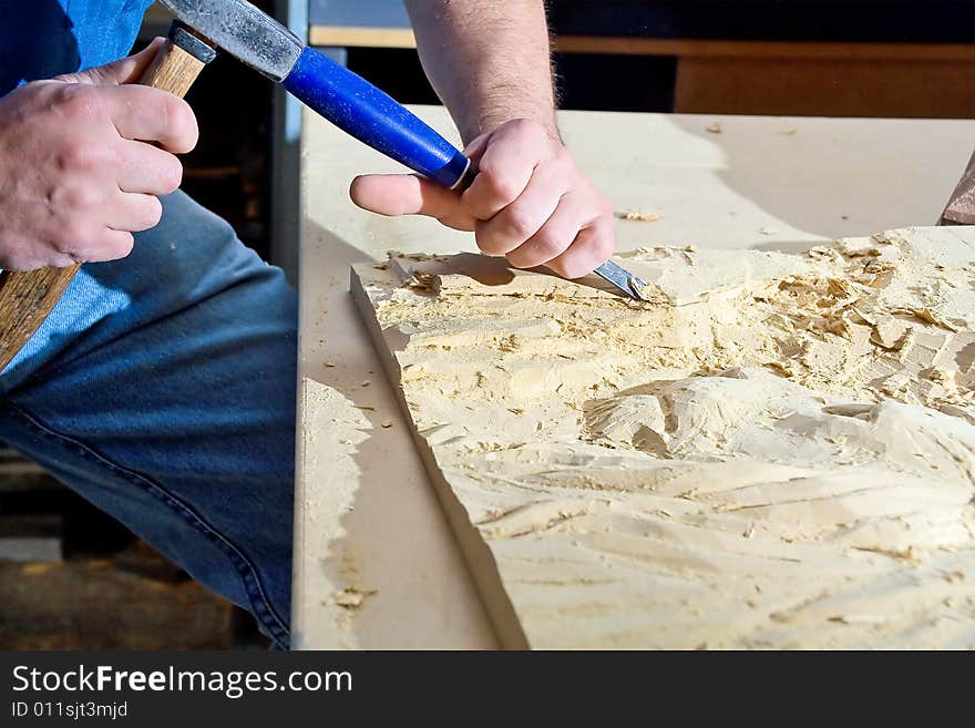 Hands of the carver. Work Place. Hands of the carver. Work Place