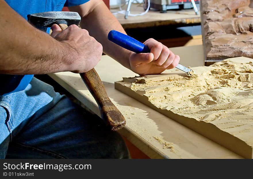 Hands of the carver.Work place. Hands of the carver.Work place