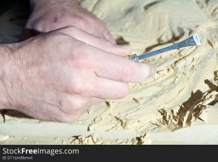 Hands of the carver.work place. Hands of the carver.work place